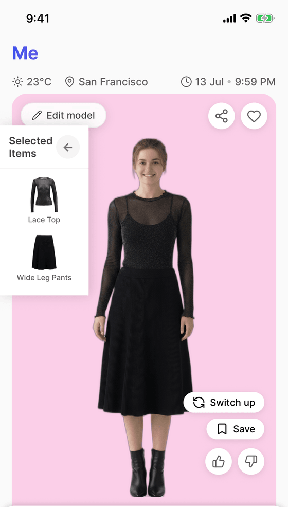 The same model in a second look: a sheer lace top over a midi skirt with ankle boots.